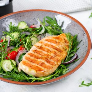 Grilled chicken fillet and fresh salad. Healthy lunch menu. Keto food.