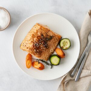 Ketogenic dinner with fish. Fillet of salmon with vegetables. Top view